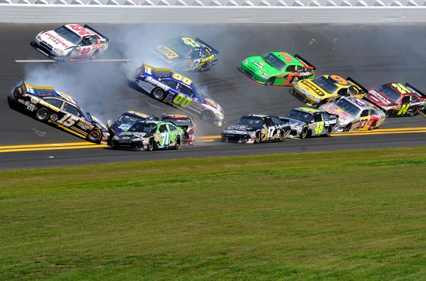 Michael Waltrip and David Reutimann spin which brings out the fourth caution of the Daytona 500. The incident involved 14 cars on lap 30 at Daytona International Speedway in Daytona Beach, Fla. Credit: John Harrelson/Getty Images for NASCAR